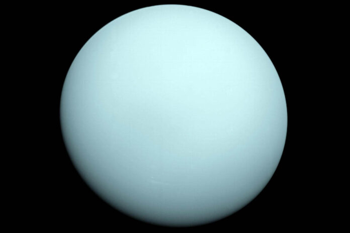 NASA’s Voyager 2 captured this image of Uranus while flying by the ice giant in 1986. New research using data from the mission shows a solar wind event took place during the flyby, leading to a mystery about the planet’s magnetosphere that now may be solved. (NASA/JPL-Caltech)