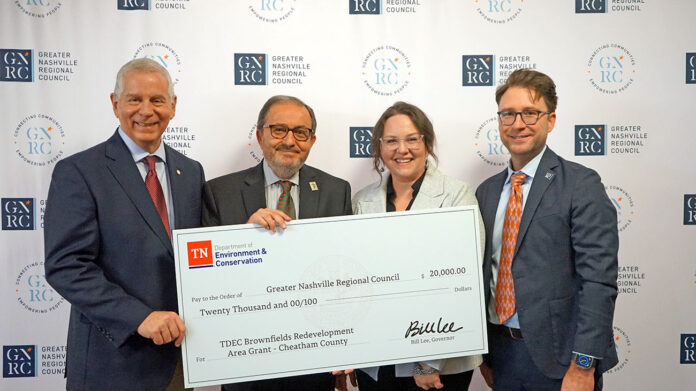 The Tennessee Department of Environment and Conservation (TDEC) presents a check for $20,000 to Cheatham County for its plans in brownfield redevelopment. From left are Joe Pitts, mayor of Clarksville and chair of the Greater Nashville Regional Council; Kerry McCarver, mayor of Cheatham County; Tara Pedraza, TDEC director of Stakeholder Engagement; and Michael Skipper, executive director of the Greater Nashville Regional Council.