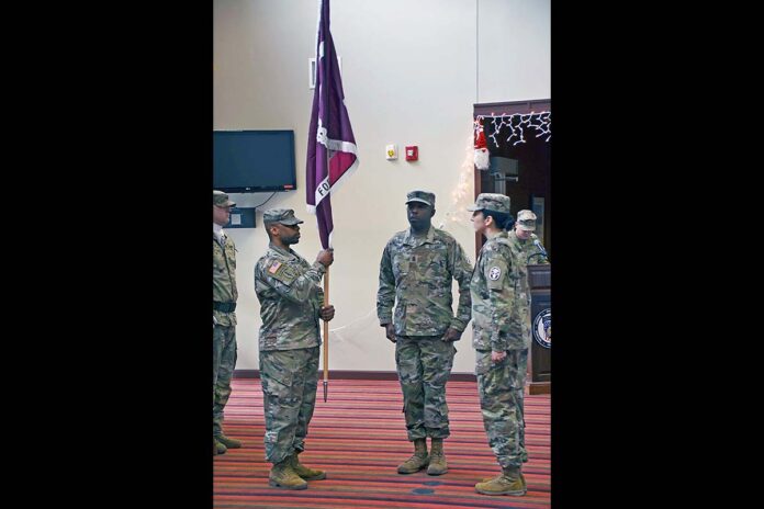 Master of Ceremony, Sgt. 1st Class Brenten prepares the Soldier Readiness Unit colors to initiate the Change of Responsibility Ceremony Dec., 13, 2024, at the SRU, Fort Campbell, Kentucky. In the ceremony, Command Sgt. Maj. Bryant Gray relinquished his responsibility following two years of dedicated service to the Soldiers, cadre and staff assigned to the SRU. (U.S. Army Photo by Master Sgt. Gina Vaile-Nelson)