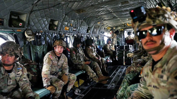 101st Airborne Division (Air Assault) Soldiers prepare to conduct Fast Rope Insertion and Extraction System (FRIES) training from the Block II CH-47F at Fort Campbell, KY. (Sgt. Matthew Wantroba, 40th Public Affairs Detachment)