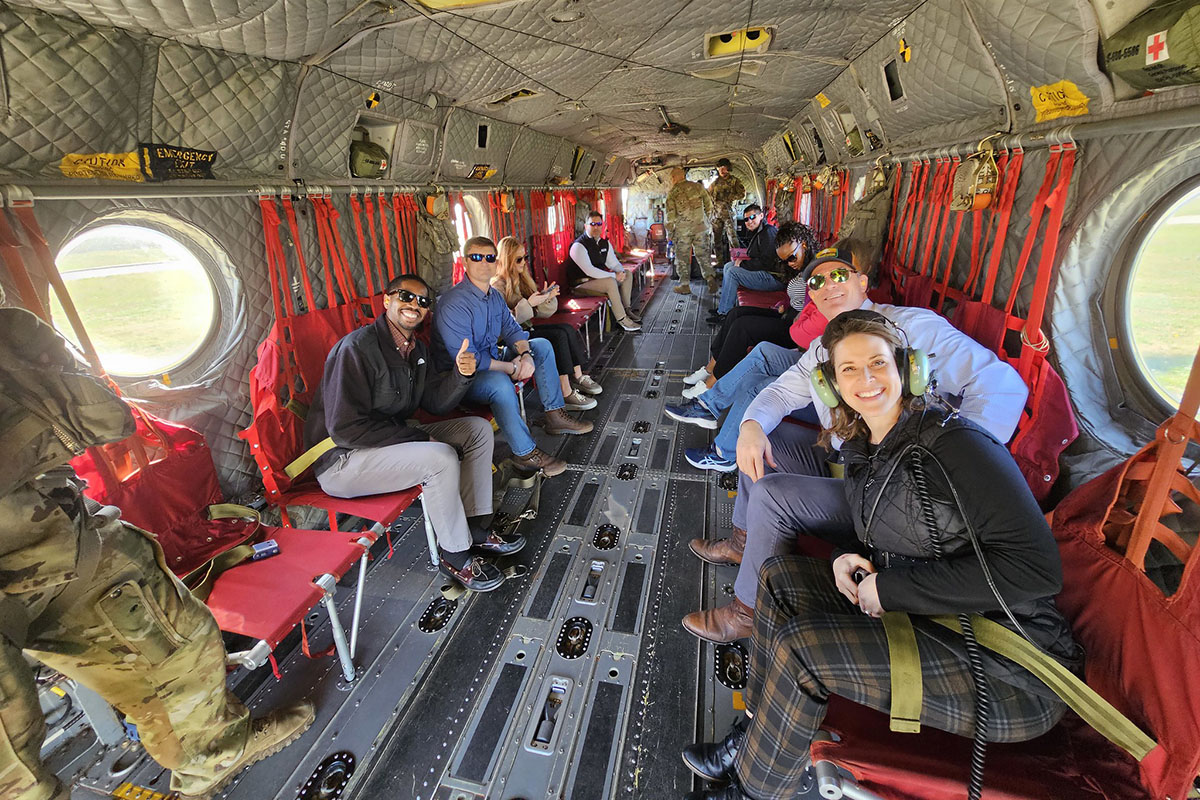 Members from the Nashville Chamber of Commerce pose for a photo on a CH-47 Chinook helicopter before an aerial tour facilitated by the 101st Combat Aviation Brigade,101st Airborne Division (Air Assault) during a visit to Fort Campbell, KY, March 26th, 2025. (US Army photo by Master Sgt. Anthony Hewitt)