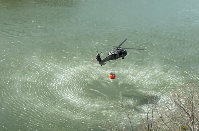 At the request of the Tennessee Emergency Management Agency (TEMA), the Tennessee National Guard is providing two UH-60 Blackhawk helicopters, from Knoxville’s 1-230th Assault Helicopter Battalion, to support wildfire response in the Chattanooga area. (Tennessee National Guard)