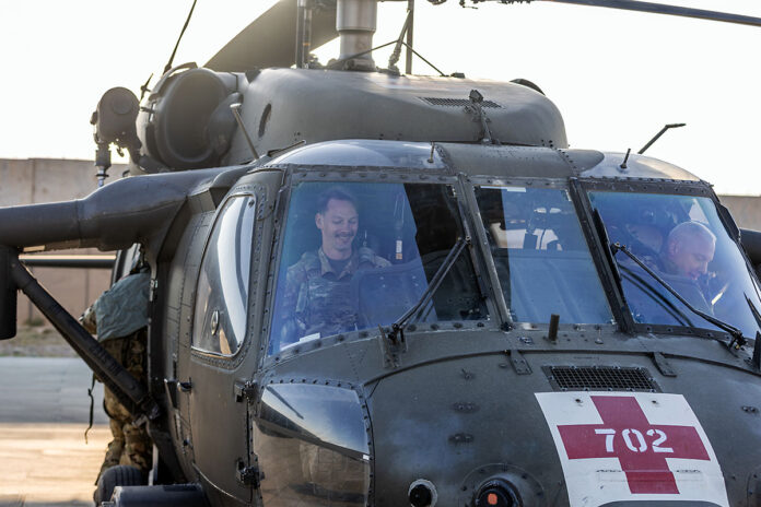 Chief Warrant Officer 4 Jason Shull and Chief Warrant Officer 2 Glenn Jones tests flight controls on a HH-60 Black Hawk Helicopter before a training flight at Al Asad Air Base, Iraq, April 15th, 2025. HH-60 Black Hawks are primarily used for aerial medical evacuation (MEDEVAC) missions and are equipped to transport wounded soldiers to medical facilities. (U.S. Army photo by Capt. Andrew Lightsey IV)