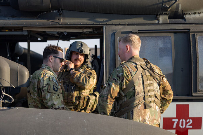 U.S. Army Soldiers prepare for a training flight on a HH-60 Black Hawk Helicopter at Al Asad Air Base, Iraq, April 15th, 2025. HH-60 Black Hawks are primarily used for aerial medical evacuation (MEDEVAC) missions and are equipped to transport wounded soldiers to medical facilities. (U.S. Army photo by Capt. Andrew Lightsey IV) 