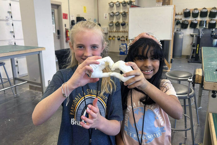 Students from Barksdale Elementary School’s Spanish Immersion Program showcase a pair of hand sculptures they made on a field trip to Austin Peay State University’s Department of Art + Design. (Contributed photo)