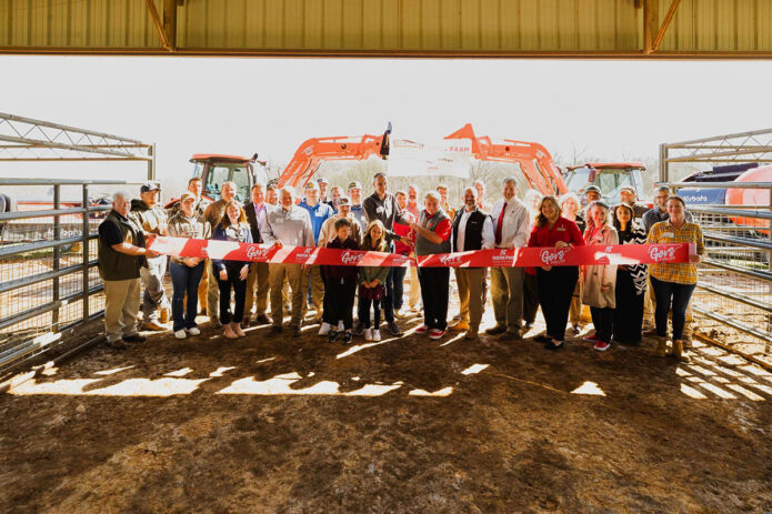 Representatives from Austin Peay State University, Coleman Tractor Company, and Kubota Tractor Corporation at a ribbon cutting ceremony for the Coleman Tractor APSU Farm Powered by Kubota. (Ralph Acosta, APSU)