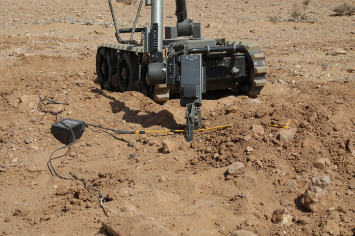 Soldiers from the 49th EOD Company, based at Fort Campbell, Ky., maneuver the MTRS INC 2 robot during improvised explosive device detection training at African Lion 2025 in Cap Draa, Morocco. The large-scale exercise brings together over 50 nations to strengthen multinational cooperation and readiness in complex operational environments. (Sgt. Jenise Burnette, U.S. Army Reserve)