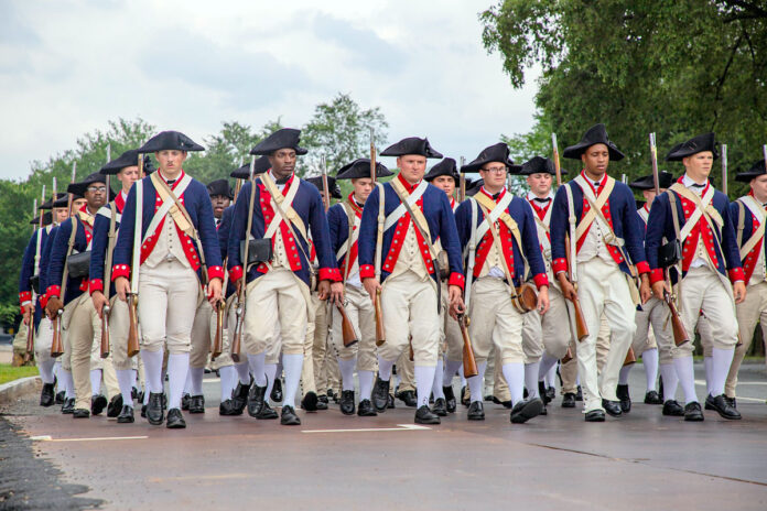 U.S Army Soldiers representing the Revolutionary War era of our nation's history from the 101st Airborne Division, based out of Fort Campbell, Kentucky, and the 3rd Infantry Division, based out of Fort Stewart, Georgia, prepare to participate in the 250th Army Birthday Parade June 14, 2025, in Washington D.C. The parade featured approximately 6,700 Soldiers, 150 vehicles, 50 aircraft, 34 horses, two mules, and one dog to highlight the Army’s 250 years of service to the nation. (U.S. Army photo by Spc. Rebeca Soria)