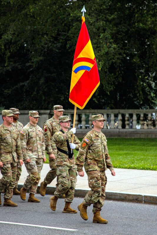U.S. Army Soldiers with the 42nd Infantry Division prepare to march in the 250th Army Birthday Parade, June 14, 2025, in Washington D.C. The parade included Soldiers in historical and modern uniforms, marching alongside equipment and vehicles from key eras of Army history to represent how the force has evolved since 1775. (U.S. Army photo by Spc. Rebeca Soria)