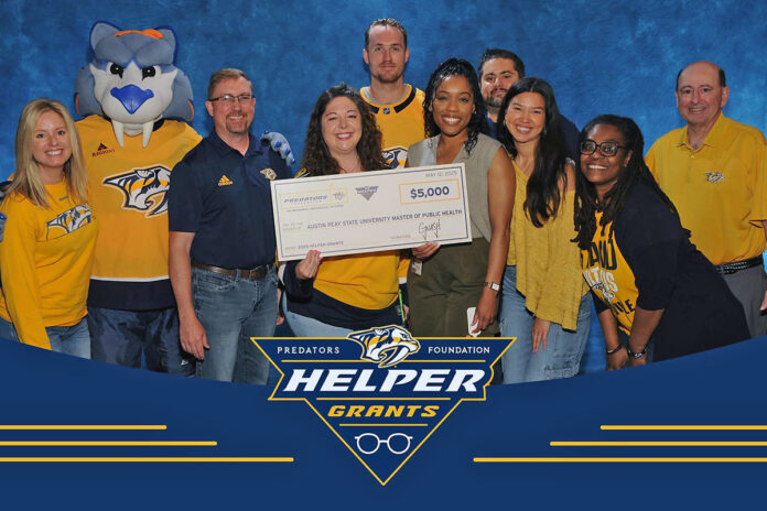 Austin Peay State University faculty and staff representatives receive a $5,000 Helper Grant from the Nashville Predators Foundation to support the Community LIFT Project, an early childhood literacy initiative. (Contributed photo)