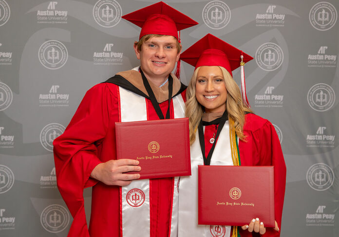 Austin Peay State University alumni Dylan Cottrell (left) and Kayla Downey (right), first-generation college students, proudly display their MBA diplomas at the university’s Spring 2025 commencement. (Robyn White, APSU)