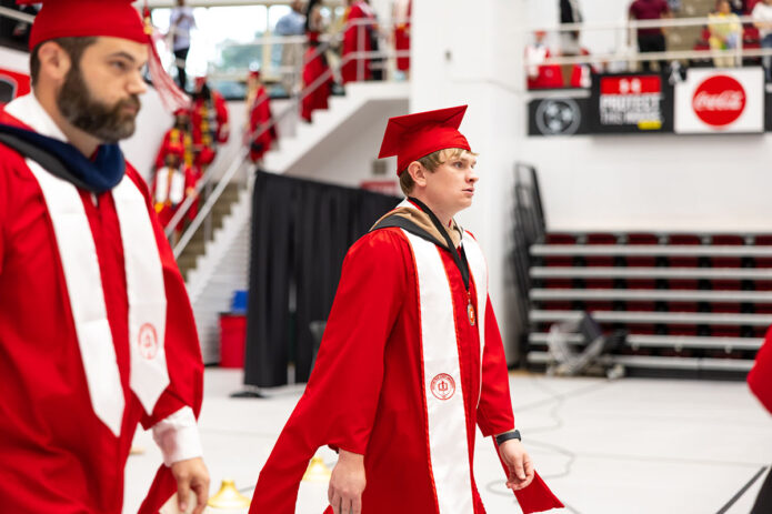 Austin Peay State University alumnus Dylan Cottrell, at right, during the processional at the university’s Spring 2025 commencement. (Sean McCully, APSU)