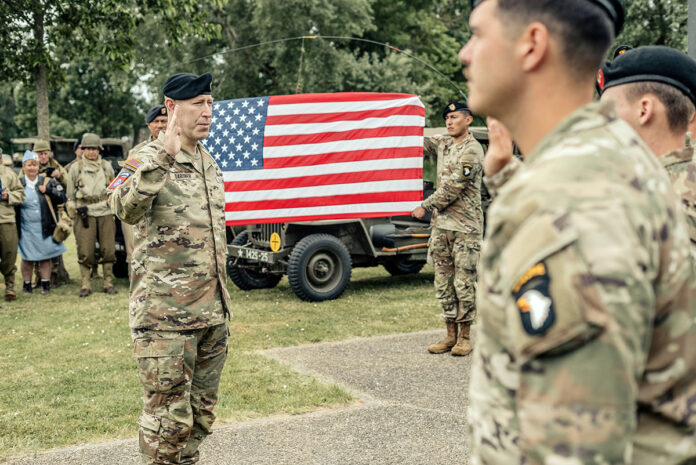 Maj. Gen. David Gardner, commanding general of the 101st Airborne Division (Air Assault) and Fort Campbell, reenlists 14 Screaming Eagles at the Cole Monument in Carentan, France on June 3, 2025 following a World War II vehicle tour of Carentan battle sites. The 14 Soldiers reenlisted to stay at Fort Campbell, Ky. 101st Airborne Division (Air Assault) Soldiers have traveled to Normandy to commemorate the 81st anniversary of D-Day and to honor the heroes and veterans that fought there. The 81st anniversary of D-Day commemorates Allied Forces that liberated the region from German occupation during World War II. (1st Lt. Dalton Worley, 101st Airborne Division (Air Assault))
