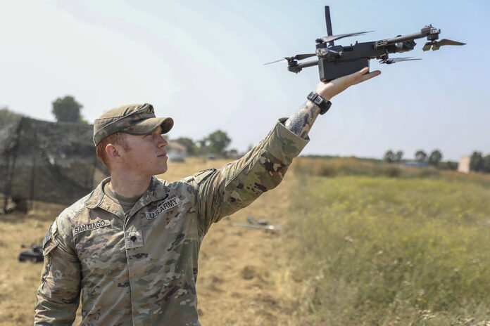 U.S. Army Spc. Harry Santiago IV, assigned to the Multi-Functional Reconnaissance Company, 2nd Brigade Combat Team, 101st Airborne Division (Air Assault), launches a Skydio X2D drone on Mihail Kogalniceanu Air Base, Romania, July 09, 2025. V Corps provides essential support to multinational training and exercises of robust and evolving complexity, scope, scale, rigor, and operational conditions and provides targeted security force assistance alongside national and multinational corps and divisions. (U.S. Army photo by Spc. Breanna Bradford)