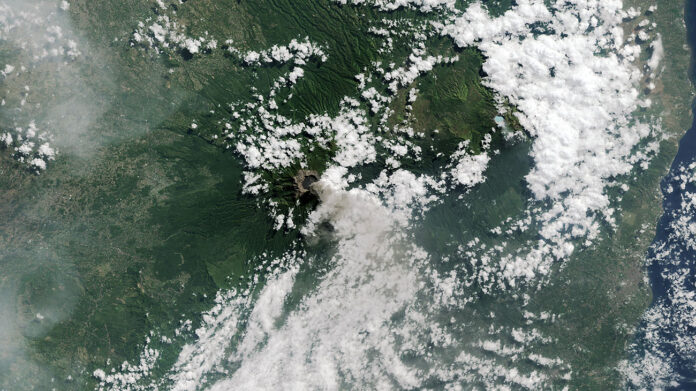 Cloud cover can keep optical instruments on satellites from clearly capturing Earth’s surface. Still in testing, JPL’s Dynamic Targeting uses AI to avoid imaging clouds, yielding a higher proportion of usable data, and to focus on phenomena like this 2015 volcanic eruption in Indonesia Landsat 8 captured. (NASA/USGS)
