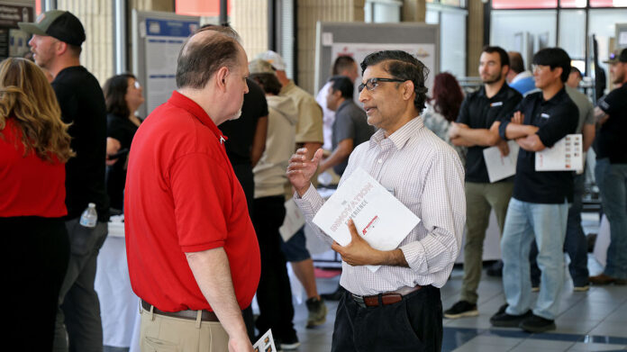 Dr. Matthew Anderson, at left, and Dr. Ravi Manimaran attend the Innovation Experience, an annual showcase for students in the Austin Pay State University College of STEM. Mechatronics students have presented several projects during the event. (Colby Wilson, APSU)