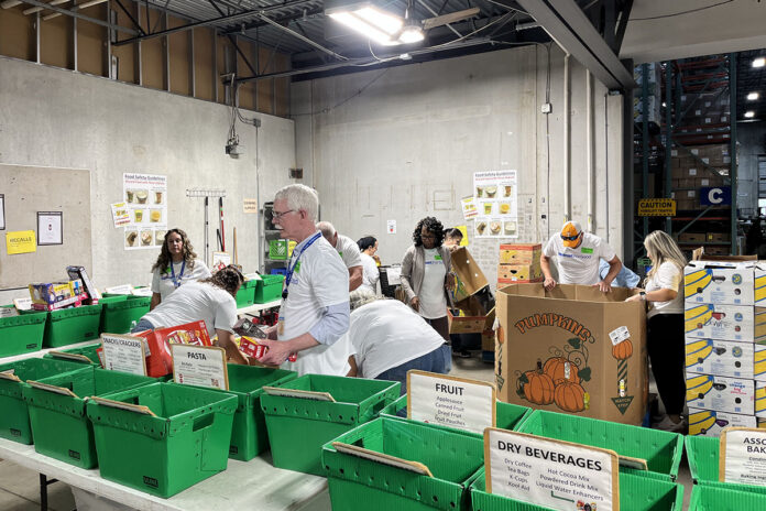 Local Walmart associates volunteer at Second Harvest Food Bank of Middle Tennessee, helping sort and pack food donations. Local Walmart associates volunteer at Second Harvest Food Bank of Middle Tennessee, helping sort and pack food donations.