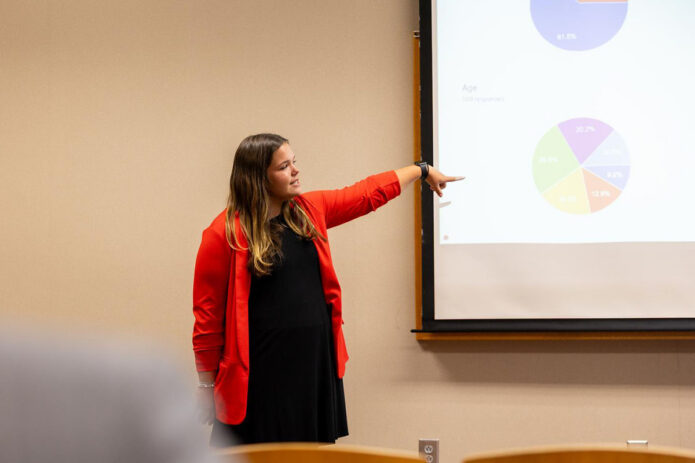 Sarah Ahlheit, a senior management student, discusses findings from an IRB-approved study on AI training gaps in commercial real estate services. Ahlheit worked with Dr. Stephanie Bilderback, instructor of management, on the study, and the two presented together at the symposium. (Sean McCully,APSU)