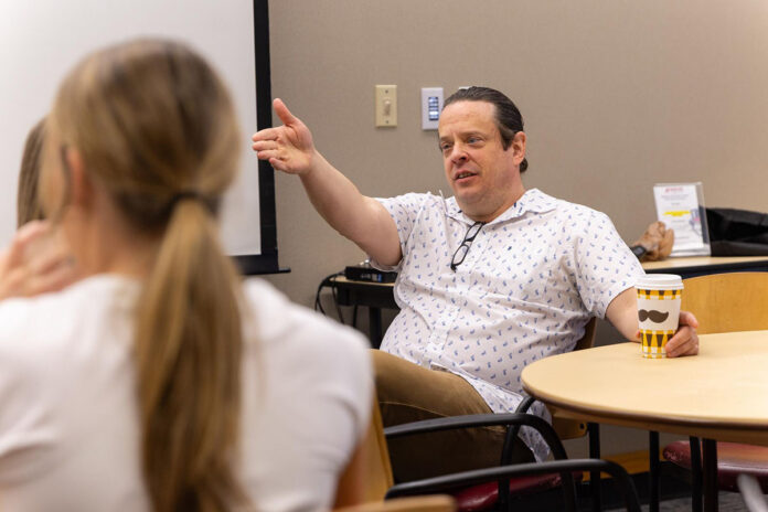 Dr. Stephen Kershner, an associate professor of classics at Austin Peay State University, speaks with students during a world languages event on campus in March 2025. (Sean McCully, APSU)