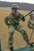 U.S. Army Spc. Hunter Wade, an infantryman assigned to the 101st Airborne Division (Air Assault), prepares to rappel from a UH-60 Blackhawk helicopter during air assault training at Fort Campbell, KY, March 2nd, 2026. Rappelling is a critical, high-stress skill for air assault operations, rapid insertion into areas where helicopters cannot land, and urban operations like entering buildings from rooftops. (Staff Sgt. Raymond Valdez)