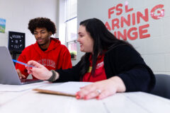Dr. Jena Collins, Full Spectrum Learning coordinator at Austin Peay State University, trains Christian Ryan, a peer tutor who assists the program’s participants, in the revamped Learning Lounge for autistic students enrolled in the program. (APSU)