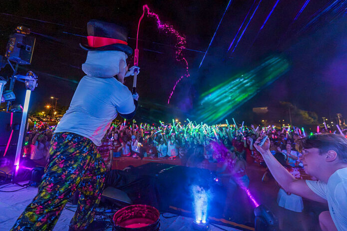 The Gov launches glow-in-the-dark paint into the crowd during Austin Peay State University’s fifth annual Glowchella, hosted on Aug. 22, 2025, at the intramural field. (Cody Hegler, The All State)