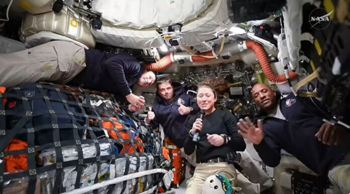 Artemis II crew members Jeremy Hansen, Reid Wiseman, Christina Koch, and Victor Glover answer questions from reporters during the first downlink event of their mission. (NASA)