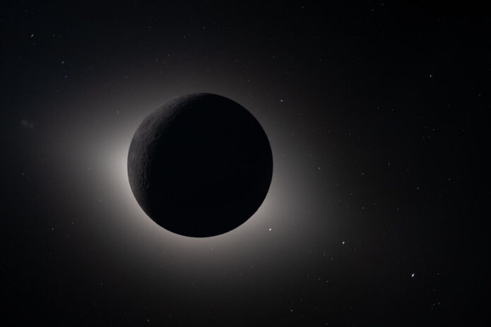 Captured by the Artemis II crew during their lunar flyby on April 6th, 2026, this image shows the Moon fully eclipsing the Sun. From the crew’s perspective, the Moon appears large enough to completely block the Sun, creating nearly 54 minutes of totality and extending the view far beyond what is possible from Earth. The corona forms a glowing halo around the dark lunar disk, revealing details of the Sun’s outer atmosphere typically hidden by its brightness. Also visible are stars, typically too faint to see when imaging the Moon, but with the Moon in darkness stars are readily imaged. This unique vantage point provides both a striking visual and a valuable opportunity for astronauts to document and describe the corona during humanity’s return to deep space. The faint glow of the nearside of the Moon is visible in this image, having been illuminated by light reflected off the Earth. (NASA)