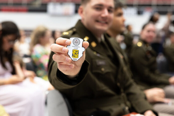 Martin shows off his 1,000th officer coin. 