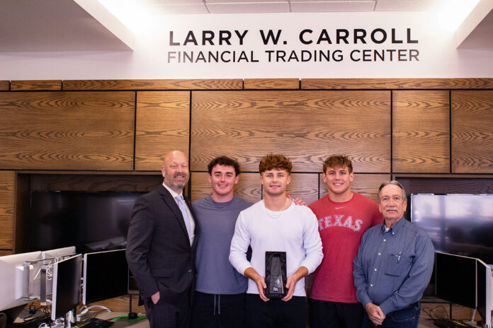 Austin Peay State University finance students and Dr. Mike Phillips present Dean Mickey Hepner with their performance award from the TVA’s Investment Challenge Program. (Contributed photo)