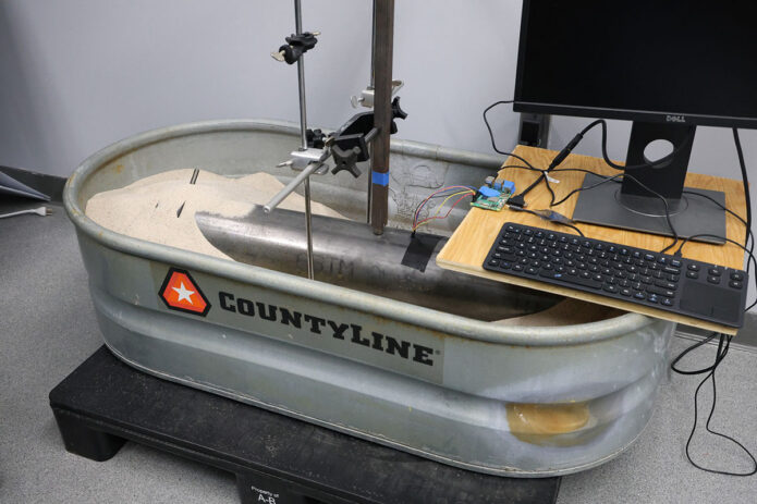 A prototype version of the pipeline inspection tool, which uses sand to simulate sediment buildup. (Colby Wilson, APSU)