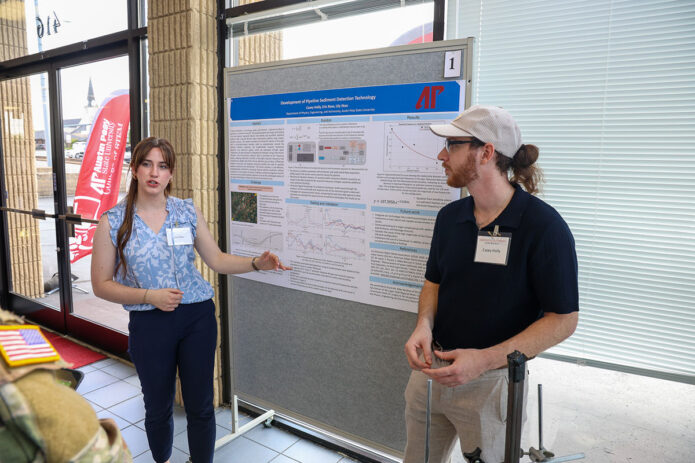 Austin Peay State University students Lily Skau and Casey Holly present their work at the College of STEM’s annual Innovation Experience. (Colby Wilson, APSU)