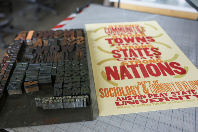 Movable type used to create the limited-edition letterpress print rests beside the finished piece at the Goldsmith Press. (Seth Riker, APSU)