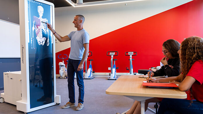 Dr. Tim Leszczak, chair of Austin Peay State University's Department of Health and Human Performance, demonstrates advanced anatomy technology inside the university's Health Professions Building. (Robyn Jacobs, APSU)