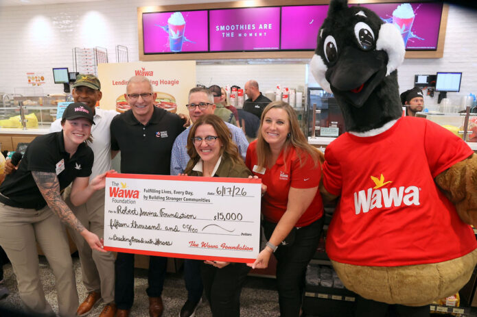 Check presentation to the Robert Irvine Foundation to support continued Breaking Bread with Heroes programming. (Mark Haynes, Clarksville Online)