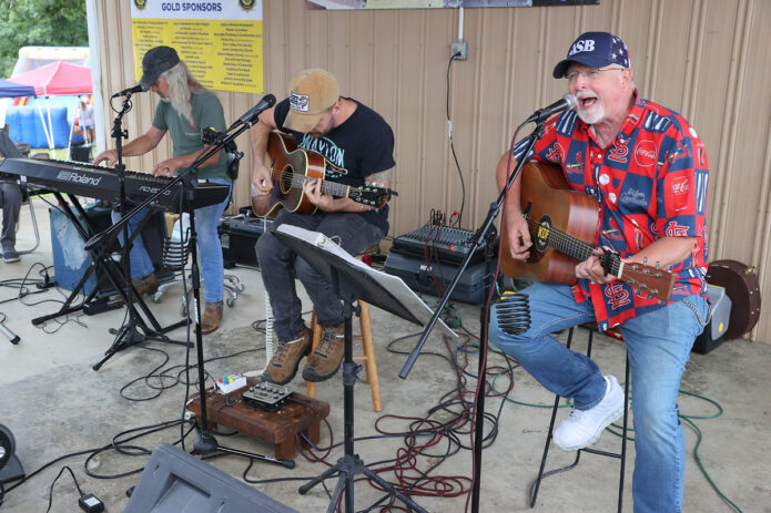 The Back Lot Pickers entertain the crowd with live bluegrass music during the 118th Annual Lone Oak Picnic in Cunningham. (Mark Haynes, Clarksville Online)