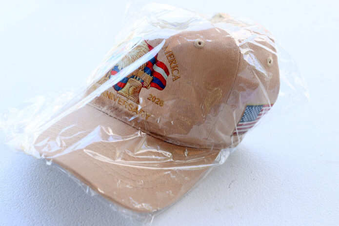 An America 250 patriotic ball cap, one of the special prizes awarded to participants who correctly answered questions during Joe Padula's Patriotic Trivia at Downtown Commons during Clarksville-Montgomery County's America's 250th Celebration. (Mark Haynes, Clarksville Online)