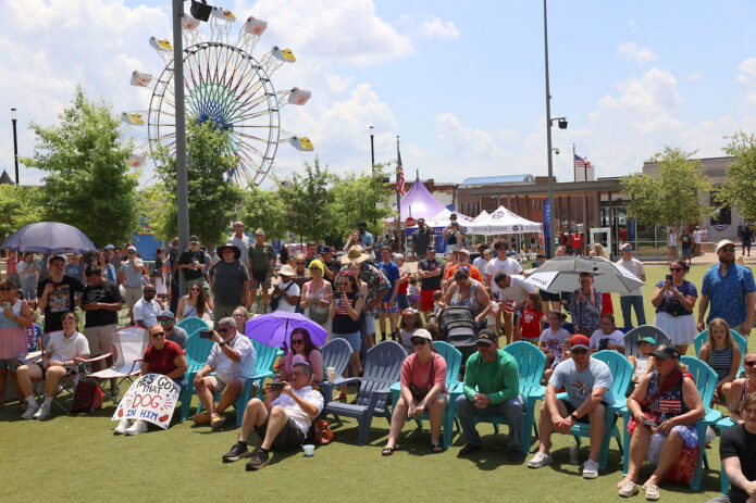 A large crowd gathers at Downtown Commons, cheering on contestants during the inaugural Lowe's Hot Dog Eating Contest, one of the most entertaining attractions at Clarksville-Montgomery County's America's 250th Celebration. (Mark Haynes, Clarksville Online)
