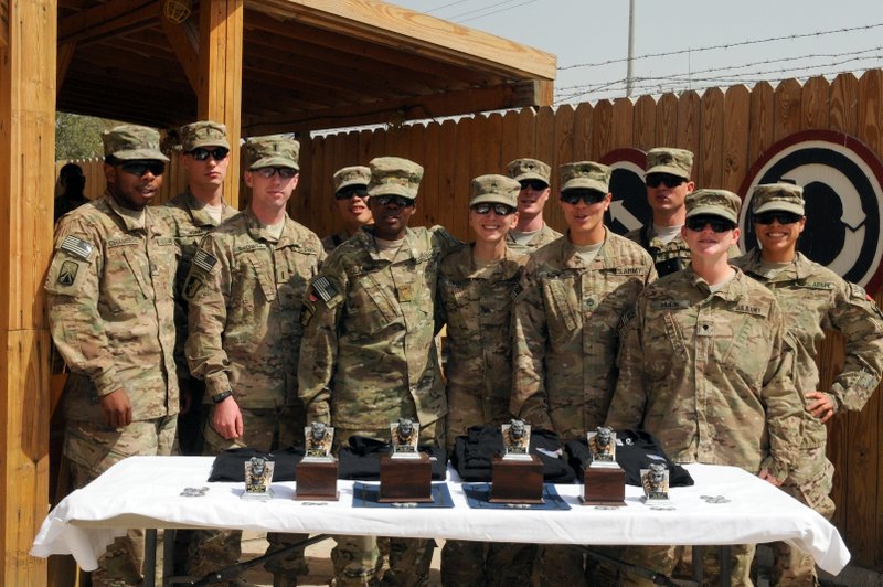 Task Force Lifeliners stand together during the 101st Special Troops Battalion Iron Dawg competition award ceremony, Sept. 28, 2013, at Bagram Air Field, Parwan province, Afghanistan. The purpose of this competition is to promote espirit de corps within the Task Force Lifeliner units. (U.S. Army photo by Sgt. Sinthia Rosario, Task Force Lifeliner Public Affairs) Task Force Lifeliners stand together during the 101st Special Troops Battalion Iron Dawg competition award ceremony, Sept. 28, 2013, at Bagram Air Field, Parwan province, Afghanistan. The purpose of this competition is to promote espirit de corps within the Task Force Lifeliner units. (U.S. Army photo by Sgt. Sinthia Rosario, Task Force Lifeliner Public Affairs)