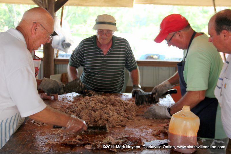 BBQ right off the pit being prepared before serving. BBQ right off the pit being prepared before serving.