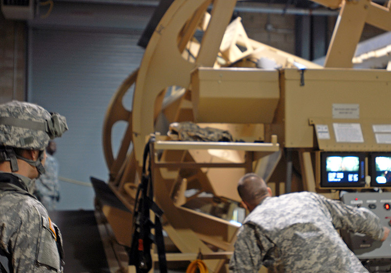 Sergeant First Class Troy Martinek, an Individual Readiness Training instructor with the 3rd Brigade Combat Team "Rakkasans," 101st Airborne Division, operates the controls to a vehicle roll-over simulator Nov. 15 at Fort Campbell, Ky so that the Soldiers inside can learn to react if they lose control of their vehicle. The IRT Program is designed to prepare late-deploying Soldiers for the Afghanistan environment. (U.S. Army photo taken by SPC Brian Smith-Dutton, 3rd Brigade Combat Team, 101st Airborne Division) Sergeant First Class Troy Martinek, an Individual Readiness Training instructor with the 3rd Brigade Combat Team "Rakkasans," 101st Airborne Division, operates the controls to a vehicle roll-over simulator Nov. 15 at Fort Campbell, Ky so that the Soldiers inside can learn to react if they lose control of their vehicle. The IRT Program is designed to prepare late-deploying Soldiers for the Afghanistan environment. (U.S. Army photo taken by SPC Brian Smith-Dutton, 3rd Brigade Combat Team, 101st Airborne Division)