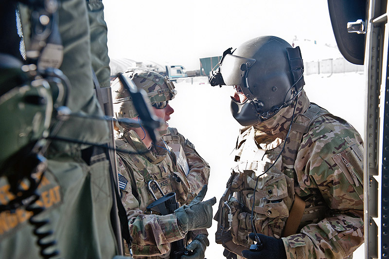 Command Sgt. Maj. Maurice Terry, 1st Battalion, 101st Combat Aviation Brigade, speaks with a passenger outside of a UH-60 Black Hawk helicopter at Bagram Airfield, Afghanistan, Jan. 19, 2013. (U.S. Army photo by Sgt. Duncan Brennan, 101st CAB public affairs) Command Sgt. Maj. Maurice Terry, 1st Battalion, 101st Combat Aviation Brigade, speaks with a passenger outside of a UH-60 Black Hawk helicopter at Bagram Airfield, Afghanistan, Jan. 19, 2013. (U.S. Army photo by Sgt. Duncan Brennan, 101st CAB public affairs)