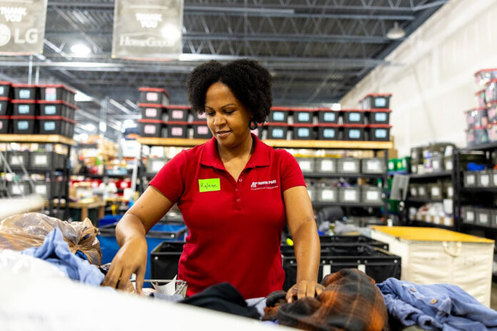 A volunteer helps organize the Yaipak warehouse during a previous Govs Week of Service, an annual initiative at Austin Peay State University. (Sean McCully, APSU)