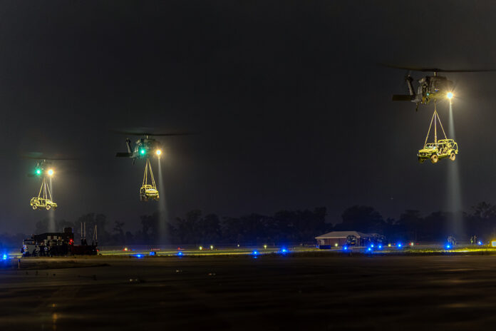 UH-60 Black Hawk helicopters from the 101st Combat Aviation Brigade, 101st Airborne Division (Air Assault) and 82nd Combat Aviation Brigade, 82nd Airborne Division take off at night with a sling of Infantry Squad Vehicles (ISV) at Intermediate Staging Base Alexandria, La. May 6, 2025 prior to providing troops with the equipment via air assault capabilities to the Joint Readiness Training Center (JRTC). This air movement represents a Large Scale, Long Range Air Assault (L2A2) which moves a brigade worth of combat power over 500 nautical miles in one period of darkness, going from Fort Campbell, KY to Fort Johnson, LA. The U.S. Army has announced that Fort Campbell has been selected as one of five military installations chosen to host an advanced, next-generation microreactor power plant under the Army's Janus Program. This milestone initiative, executed in close partnership with the Defense Innovation Unit (DIU), aims to secure uninterrupted, resilient power for critical defense missions; missions that could include utilizing air movement like a L2A2. (Spc. Alexander Goff, U.S. Army)