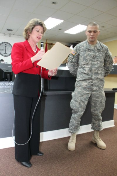 Joseph Demille receiving the Mayor’s certificate. (Photo by CPD-Jim Knoll) Joseph Demille receiving the Mayor’s certificate. (Photo by CPD-Jim Knoll)