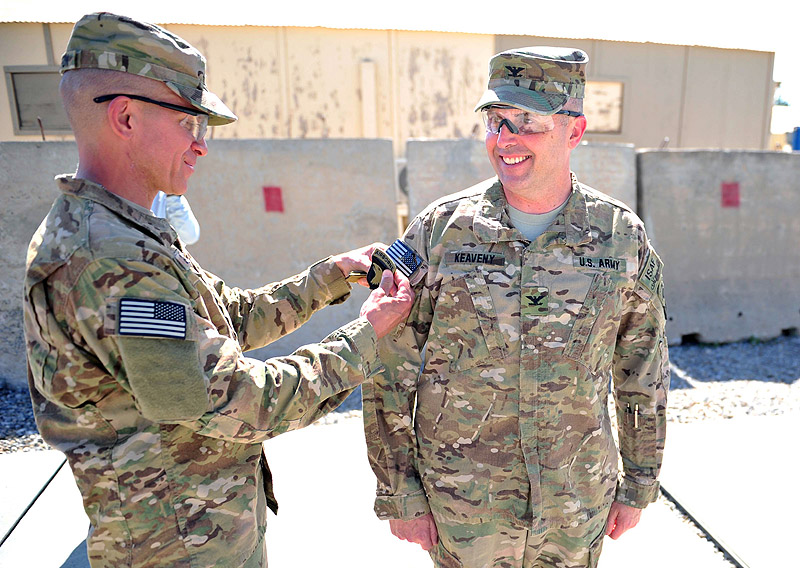 U.S. Army Col. Val C. Keaveny Jr., commander of the 4th Brigade Combat team “Currahee”, 101st Airborne Division (Air Assault), receives the 101st combat patch from Command Sgt. Maj. Michael A. Grinston, command sergeant major of the 4th BCT, 101st Abn. Div., during a patch ceremony at Forward Operating Base Salerno, Afghanistan, on June 6, 2013 (U.S. Army photo by Sgt. Justin A. Moeller, 4th Brigade Combat Team Publuc Affairs) U.S. Army Col. Val C. Keaveny Jr., commander of the 4th Brigade Combat team “Currahee”, 101st Airborne Division (Air Assault), receives the 101st combat patch from Command Sgt. Maj. Michael A. Grinston, command sergeant major of the 4th BCT, 101st Abn. Div., during a patch ceremony at Forward Operating Base Salerno, Afghanistan, on June 6, 2013 (U.S. Army photo by Sgt. Justin A. Moeller, 4th Brigade Combat Team Publuc Affairs)