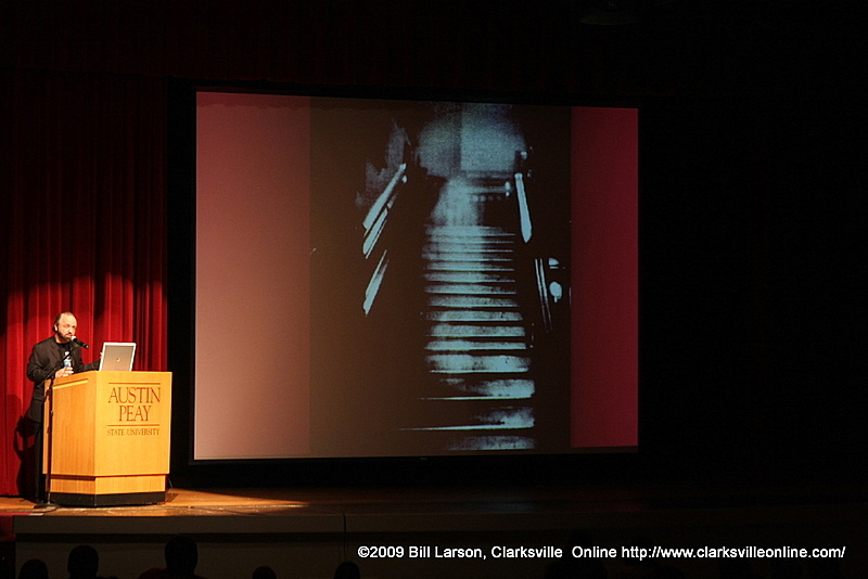 A ghost figure walks down a flight of stairs A ghost figure walks down a flight of stairs