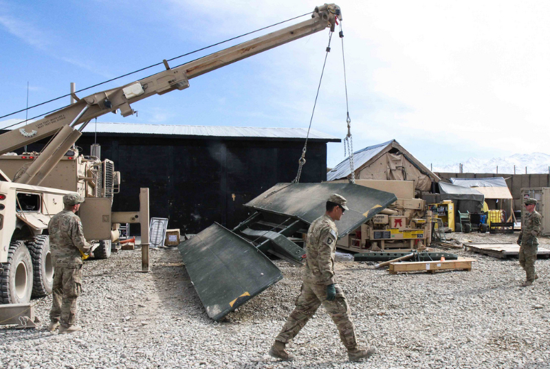 Soldiers assigned to Company E, 1st Battalion, 187th Infantry Regiment, 3rd Brigade Combat Team "Rakkasans,” 101st Airborne Division (Air Assault), work to move a collapsible bridge system in preparation for transport on Forward Operating Base Gardez, Afghanistan, Jan. 24, 2013. The bridge system may be requested at any time and Soldiers are required to have it mission ready at a moment’s notice. (Spc. Brian Smith-Dutton/U.S. Army) Soldiers assigned to Company E, 1st Battalion, 187th Infantry Regiment, 3rd Brigade Combat Team "Rakkasans,” 101st Airborne Division (Air Assault), work to move a collapsible bridge system in preparation for transport on Forward Operating Base Gardez, Afghanistan, Jan. 24, 2013. The bridge system may be requested at any time and Soldiers are required to have it mission ready at a moment’s notice. (Spc. Brian Smith-Dutton/U.S. Army)