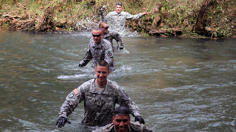Soldiers from the 163rd Military Police Detachment, 716th Military Police Battalion, 101st Sustainment Brigade, 101st Airborne Division (Air Assault), performs a water crossing in the litter carry portion of the Peacekeeper Challenge Oct. 2, at Fort Campbell, Ky. The Peacekeeper Challenge was an opportunity for the battalion to come together and honor fallen Soldiers in a rigorous physical competition. (U.S. Army photo by Sgt. Leejay Lockhart, 101st Sustainment Brigade Public Affairs) Soldiers from the 163rd Military Police Detachment, 716th Military Police Battalion, 101st Sustainment Brigade, 101st Airborne Division (Air Assault), performs a water crossing in the litter carry portion of the Peacekeeper Challenge Oct. 2, at Fort Campbell, Ky. The Peacekeeper Challenge was an opportunity for the battalion to come together and honor fallen Soldiers in a rigorous physical competition. (U.S. Army photo by Sgt. Leejay Lockhart, 101st Sustainment Brigade Public Affairs)