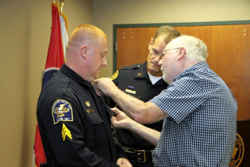 Sgt Steve Hamilton is being pinned by his father. (Photo by CPD-Jim Knoll) Sgt Steve Hamilton is being pinned by his father. (Photo by CPD-Jim Knoll)